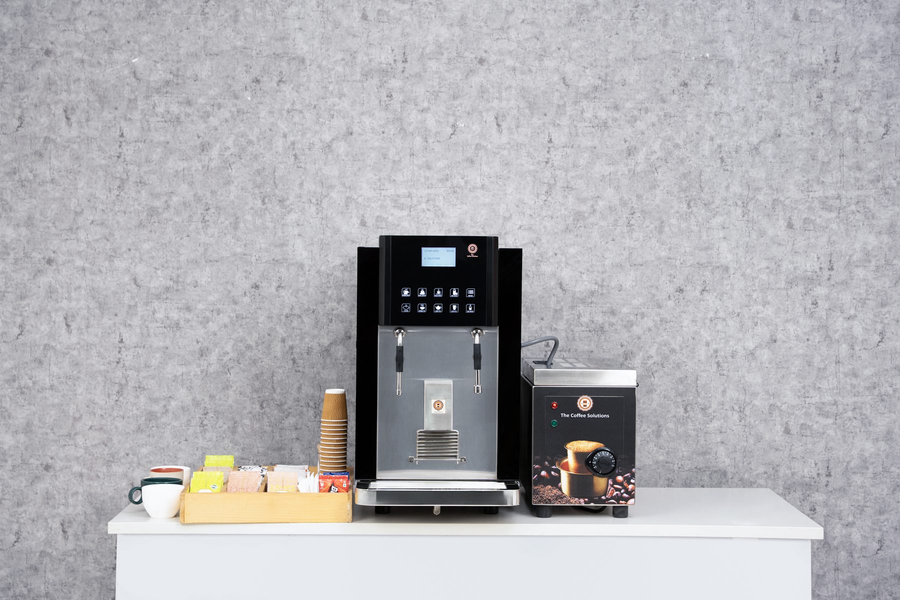 People enjoying coffee around RoyalCafe machine